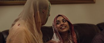 Movie still from “After Love” (2020), directed by Aleem Khan – Two women are talking on the couch; Close Up shot, Over the shoulder angle