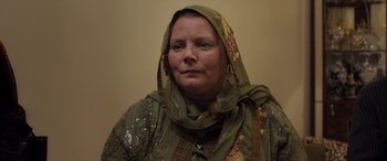Movie still from “After Love” (2020), directed by Aleem Khan – A person wearing a headscarf; Close Up shot, Low angle