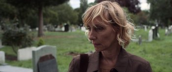 Movie still from “After Love” (2020), directed by Aleem Khan – A person wearing a brown jacket; Close Up shot, Over the shoulder angle