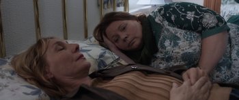 Movie still from “After Love” (2020), directed by Aleem Khan – A woman laying in bed next to another woman; Close Up shot, High angle