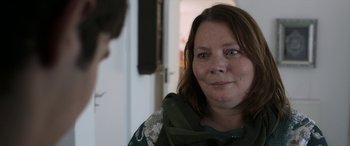 Movie still from “After Love” (2020), directed by Aleem Khan – A person wearing a scarf; Close Up shot, Over the shoulder angle