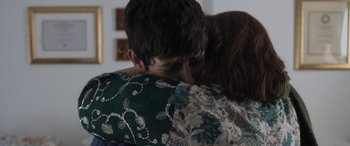 Movie still from “After Love” (2020), directed by Aleem Khan – A man and a woman hugging each other in a living room; Close Up shot, Over the shoulder angle