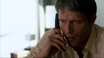 Movie still from “After the Wedding” (2006), directed by Susanne Bier – A person talking on a cell phone; Close Up shot, High angle