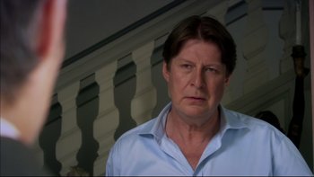 Movie still from “After the Wedding” (2006), directed by Susanne Bier – A person wearing a blue shirt; Close Up shot, Over the shoulder angle