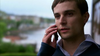 Movie still from “After the Wedding” (2006), directed by Susanne Bier – A man is talking on a cell phone outside; Close Up shot, Low angle