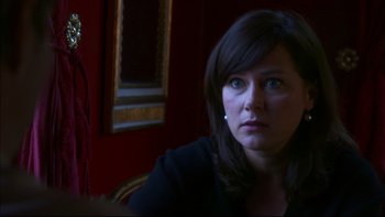 Movie still from “After the Wedding” (2006), directed by Susanne Bier – A person sitting in a room; Close Up shot, Over the shoulder angle