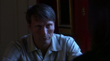 Movie still from “After the Wedding” (2006), directed by Susanne Bier – A person sitting in a room; Close Up shot, Over the shoulder angle