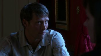 Movie still from “After the Wedding” (2006), directed by Susanne Bier – A person sitting in a room; Close Up shot, Over the shoulder angle