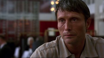 Movie still from “After the Wedding” (2006), directed by Susanne Bier – A person wearing a tan shirt; Close Up shot, Over the shoulder angle