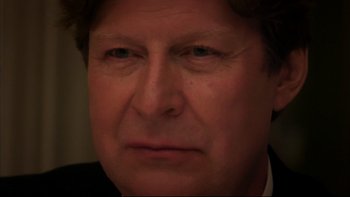 Movie still from “After the Wedding” (2006), directed by Susanne Bier – A man's face in a dark room; Close Up shot, Over the shoulder angle