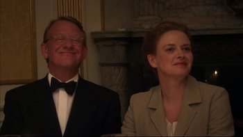 Movie still from “After the Wedding” (2006), directed by Susanne Bier – A man and a woman in a suit and bow tie; Medium shot, Low angle