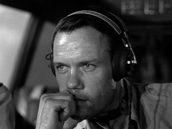 Movie still from “Air Force” (1943), directed by Howard Hawks – Black and white photograph of a man wearing headphones; Close Up shot, Low angle