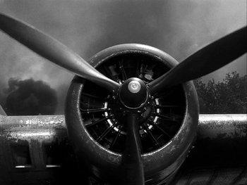 Movie still from “Air Force” (1943), directed by Howard Hawks – View of the propellers of an airplane; Extreme Close Up shot, Low angle