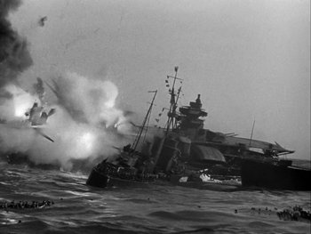 Movie still from “Air Force” (1943), directed by Howard Hawks – An old photo of a boat in the ocean; Extreme Wide shot, Low angle