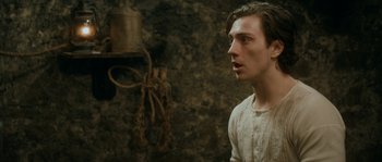 Movie still from “Albert Nobbs” (2011), directed by Rodrigo García – A man standing in front of a wall with ropes; Close Up shot, Over the shoulder angle