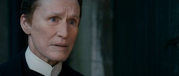 Movie still from “Albert Nobbs” (2011), directed by Rodrigo García – An older man wearing a suit and a white shirt; Close Up shot, Over the shoulder angle