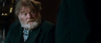 Movie still from “Albert Nobbs” (2011), directed by Rodrigo García – An old man with a beard and a suit; Close Up shot, Over the shoulder angle