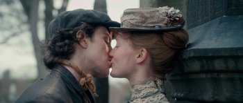 Movie still from “Albert Nobbs” (2011), directed by Rodrigo García – A man and a woman kissing each other on the lips; Extreme Close Up shot, Low angle