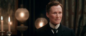 Movie still from “Albert Nobbs” (2011), directed by Rodrigo García – A man in a suit and tie looking to his left; Close Up shot, Over the shoulder angle