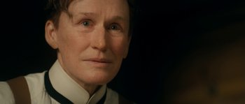 Movie still from “Albert Nobbs” (2011), directed by Rodrigo García – An older woman is looking into the camera; Close Up shot, Over the shoulder angle