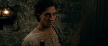 Movie still from “Albert Nobbs” (2011), directed by Rodrigo García – A man in a brown shirt is looking at the camera; Close Up shot, Over the shoulder angle