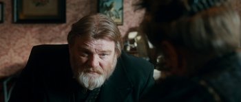 Movie still from “Albert Nobbs” (2011), directed by Rodrigo García – An old man with a beard and a suit; Close Up shot, Over the shoulder angle