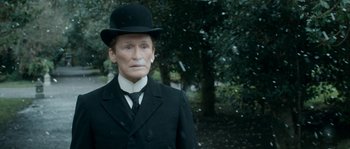 Movie still from “Albert Nobbs” (2011), directed by Rodrigo García – An old man in a suit and a top hat; Close Up shot, High angle