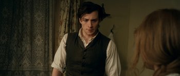 Movie still from “Albert Nobbs” (2011), directed by Rodrigo García – A man in a vest and a white shirt looking at the camera; Medium shot, Over the shoulder angle