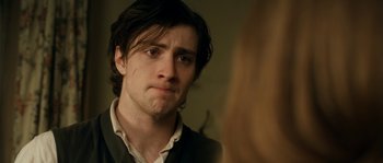 Movie still from “Albert Nobbs” (2011), directed by Rodrigo García – A man looking at his reflection in a mirror; Close Up shot, Over the shoulder angle