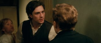 Movie still from “Albert Nobbs” (2011), directed by Rodrigo García – A man talking to another man in front of a mirror; Close Up shot, Over the shoulder angle