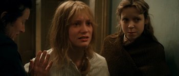 Movie still from “Albert Nobbs” (2011), directed by Rodrigo García – Two women standing next to each other in a room; Close Up shot, Over the shoulder angle