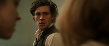 Movie still from “Albert Nobbs” (2011), directed by Rodrigo García – A man with long hair is looking at the camera; Close Up shot, Over the shoulder angle