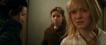 Movie still from “Albert Nobbs” (2011), directed by Rodrigo García – Two young girls are looking in the same mirror; Close Up shot, Over the shoulder angle