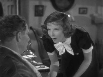 Movie still from “Alice Adams” (1935), directed by George Stevens – An old photo of a woman talking to a man; Close Up shot, Over the shoulder angle