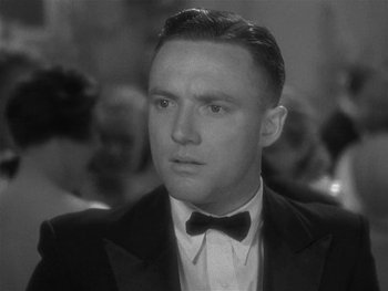 Movie still from “Alice Adams” (1935), directed by George Stevens – A man in a suit and bow tie looking to his left; Close Up shot, Low angle