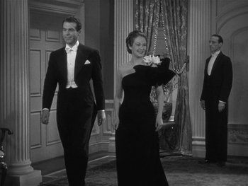 Movie still from “Alice Adams” (1935), directed by George Stevens – A man and a woman dressed in formal wear; Medium shot, Low angle