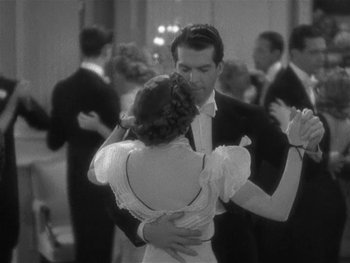 Movie still from “Alice Adams” (1935), directed by George Stevens – A man and a woman are dancing in a ballroom; Medium shot, High angle
