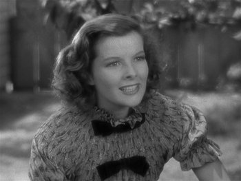 Movie still from “Alice Adams” (1935), directed by George Stevens – An old photo of a young woman in a sweater; Close Up shot, High angle
