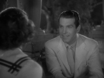 Movie still from “Alice Adams” (1935), directed by George Stevens – A black and white photo of a man and a woman; Close Up shot, Over the shoulder angle