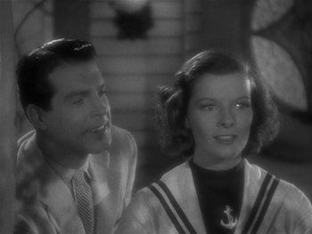 Movie still from “Alice Adams” (1935), directed by George Stevens – A man and a woman sitting next to each other; Close Up shot, Over the shoulder angle