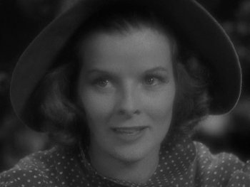 Movie still from “Alice Adams” (1935), directed by George Stevens – A black - and - white photo of a woman wearing a hat; Close Up shot, Low angle