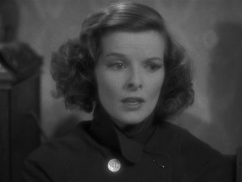 Movie still from “Alice Adams” (1935), directed by George Stevens – A black - and - white photo of a woman in a jacket; Close Up shot, High angle