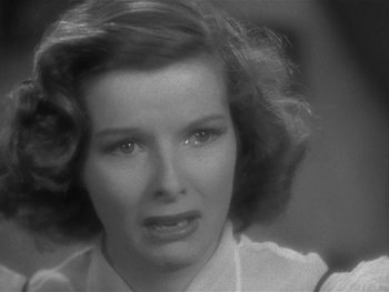 Movie still from “Alice Adams” (1935), directed by George Stevens – An old photo of a woman looking sad; Close Up shot, Over the shoulder angle