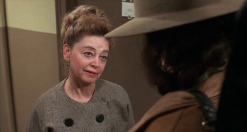 Movie still from “Alice's Restaurant” (1969), directed by Arthur Penn – A woman in a hat looking at a man in a hat; Close Up shot, Over the shoulder angle