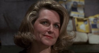 Movie still from “Alice's Restaurant” (1969), directed by Arthur Penn – A person wearing a brown shirt; Close Up shot, Low angle