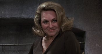 Movie still from “Alice's Restaurant” (1969), directed by Arthur Penn – A person wearing a brown shirt; Close Up shot, Over the shoulder angle