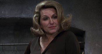 Movie still from “Alice's Restaurant” (1969), directed by Arthur Penn – A person wearing a brown shirt; Close Up shot, Over the shoulder angle