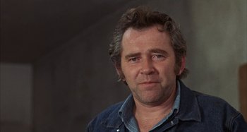 Movie still from “Alice's Restaurant” (1969), directed by Arthur Penn – A person wearing a jean jacket; Close Up shot, Low angle