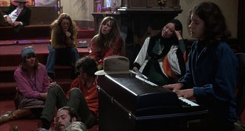 Movie still from “Alice's Restaurant” (1969), directed by Arthur Penn – A group of people sitting around a piano; Medium shot, High angle