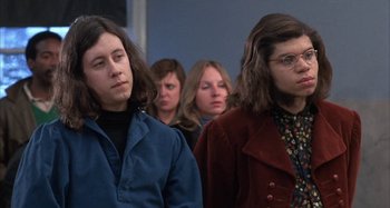 Movie still from “Alice's Restaurant” (1969), directed by Arthur Penn – A group of women standing next to each other in a room; Medium shot, Low angle